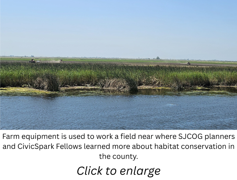 Farm equipment working a field with a caption and \