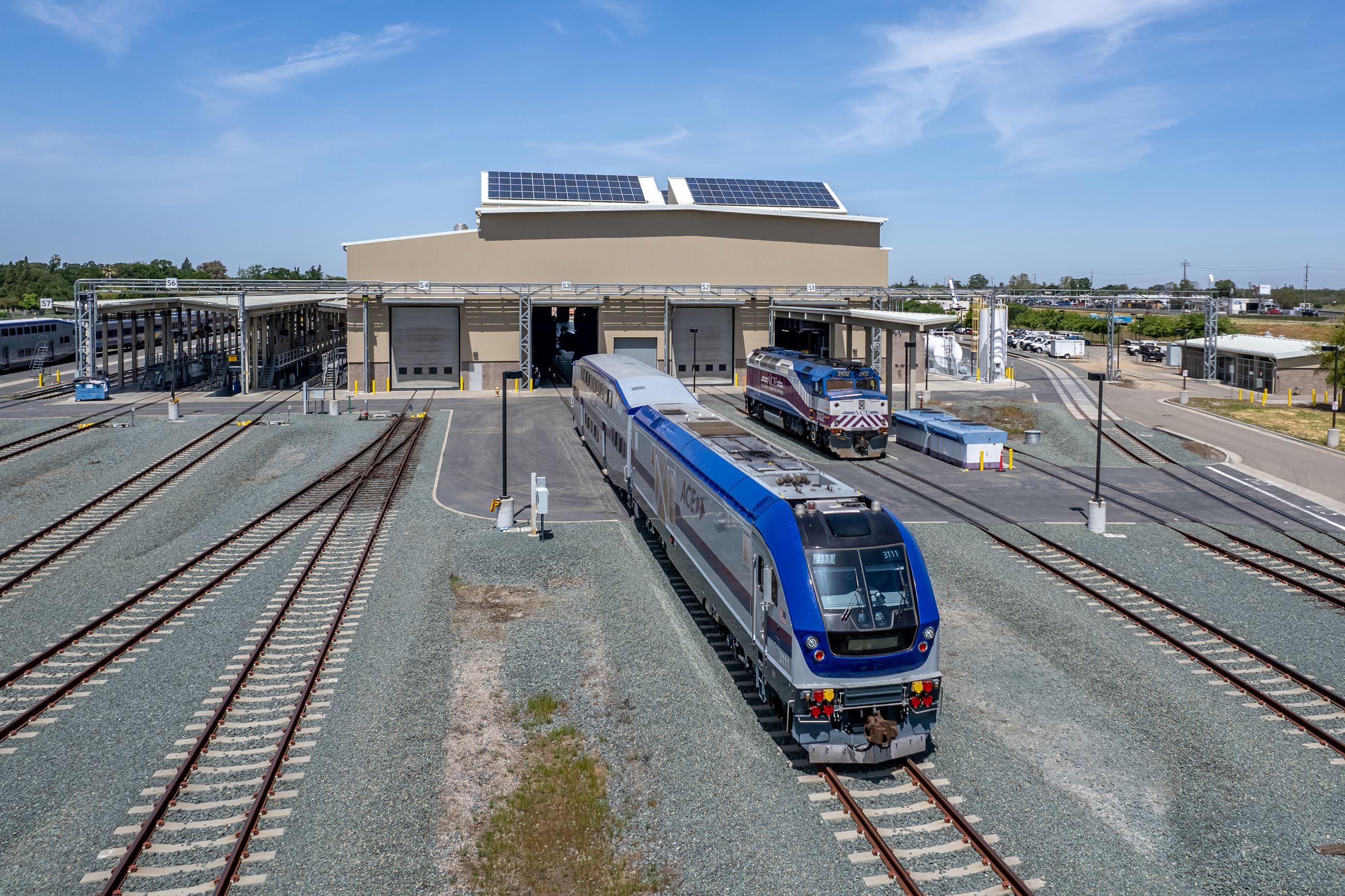 Two Altamont Corridor Express (ACE) trains just outside the maintenance facility.